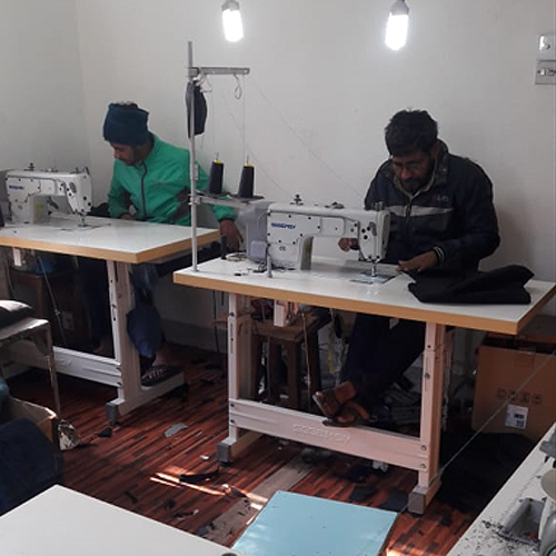 Nepali men at work on sewing machines