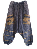 Wholesale stonewashed harem pants handmade in Nepal featuring a crinkle finish, contrast stripe detailing, front zip pockets and a relaxed cotton harem fit.
