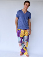 Wholesale Ram Nam patchwork hippie pants handmade in Nepal featuring sacred Hindu symbols, traditional mantra prints, and colourful cotton patchwork.