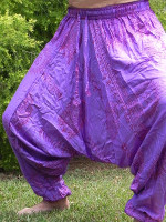 Lightweight Ram Naam cotton yoga harem pants featuring sacred prints, an elasticated waistband, a low drop crotch and gathered ankles.