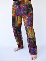 Wholesale patchwork tie dye cotton pants handmade in Nepal featuring colourful patchwork panels, a scattered tie dye pattern and a relaxed cotton fit.