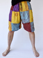 Wholesale Ram Nam patchwork hippie shorts handmade in Nepal featuring colourful cotton patchwork panels with traditional hand-printed sacred mantras and symbols.