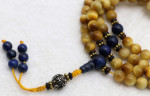 Black inlaid bone mala with 108 beads.