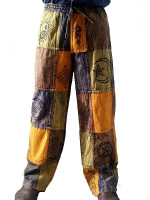 Wholesale stonewashed printed patchwork pants handmade in Nepal featuring mineral-washed cotton panels, hand-printed ethnic symbols, and a relaxed hippie fit.