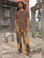 Wholesale stonewashed printed patchwork pants handmade in Nepal featuring mineral-washed cotton panels, hand-printed ethnic symbols, and a relaxed hippie fit.