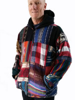 Wholesale fleece-lined patchwork jacket handmade in Nepal featuring a multicoloured mix of Gheri and acrylic fabric panels, a full-zip front, and a black hood.